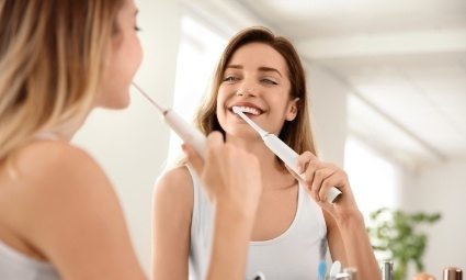 Woman brushing teeth