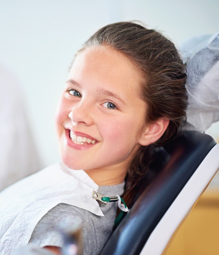 Young dental patient sharing healthy smile