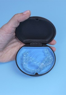 Invisalign aligners in blue case