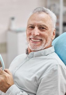 man smiling in dental chair